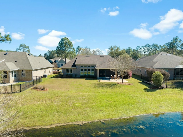 exterior space with a patio area, a lawn, and a fenced backyard