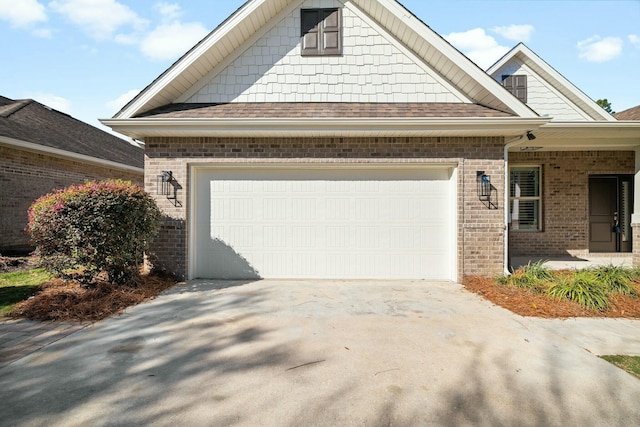 view of front of home with a garage, brick siding, concrete driveway, and a shingled roof