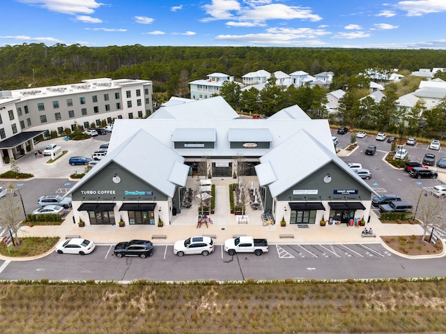 drone / aerial view featuring a forest view