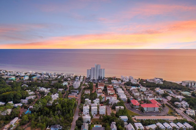 aerial view at dusk with a water view