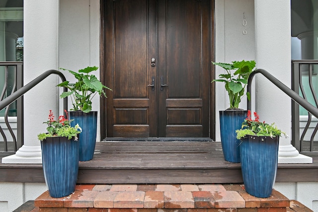 doorway to property with stucco siding