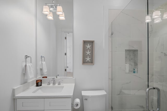 full bath featuring a shower stall, toilet, and vanity