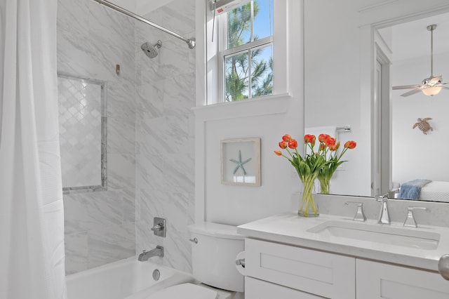 full bathroom featuring toilet, vanity, shower / tub combo, and ceiling fan