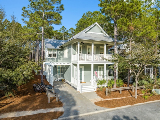 44 Thicket Cir, Santa Rosa Beach, FL 32459 - view of front of property with covered porch, french doors, and a balcony