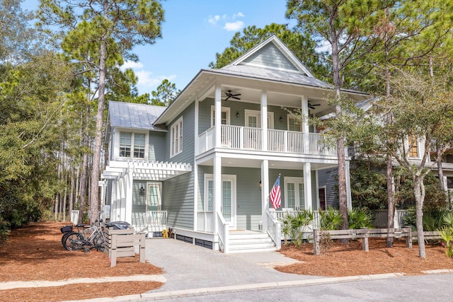 view of front of property with a balcony, ceiling fan, metal roof, covered porch, and a pergola