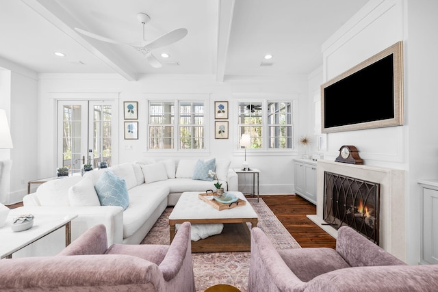 44 Thicket Cir, Santa Rosa Beach, FL 32459 - living area featuring dark wood finished floors, beamed ceiling, ceiling fan, a warm lit fireplace, and recessed lighting