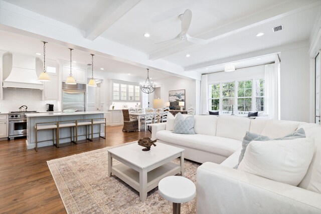 44 Thicket Cir, Santa Rosa Beach, FL 32459 - living area featuring beam ceiling, a ceiling fan, recessed lighting, dark wood finished floors, and a chandelier