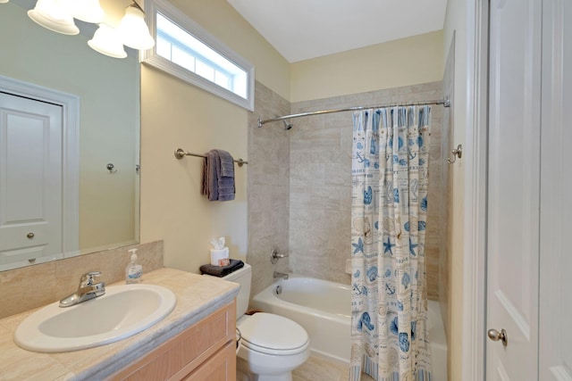 bathroom with shower / tub combo, vanity, and toilet