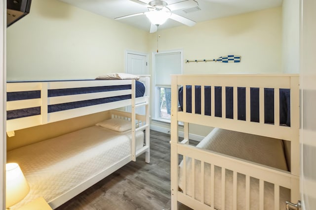 bedroom featuring visible vents and wood finished floors