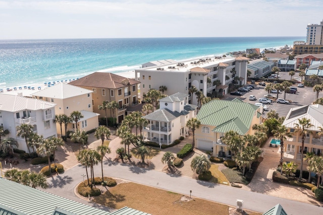 drone / aerial view featuring a water view and a view of the beach