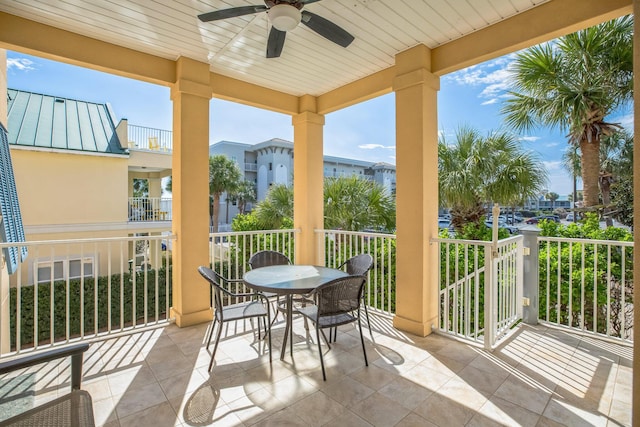 balcony featuring outdoor dining space and a ceiling fan