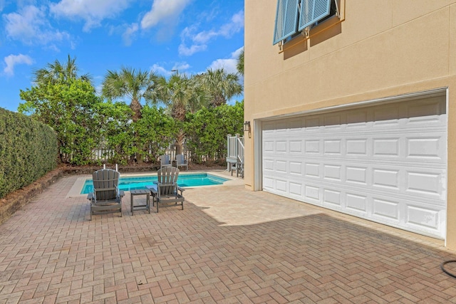 pool with fence and a patio