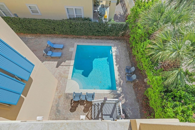 view of swimming pool featuring a patio area