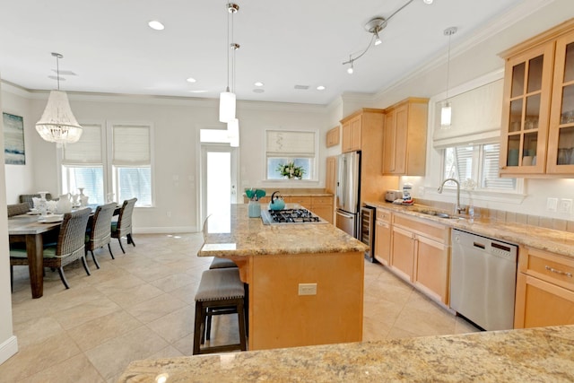 kitchen with light brown cabinets, stainless steel appliances, a sink, glass insert cabinets, and crown molding