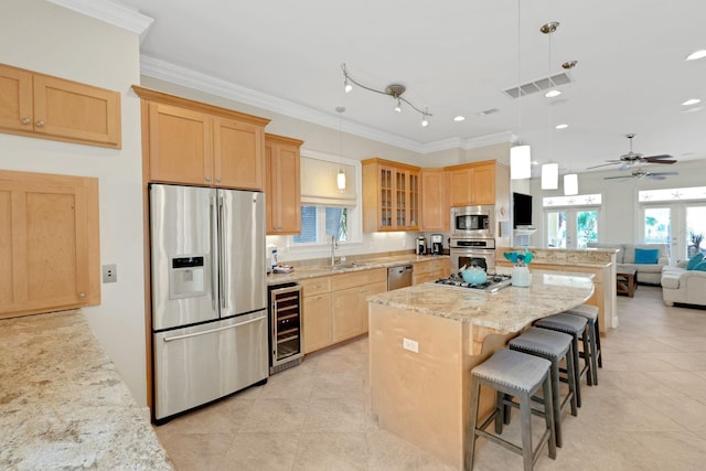 kitchen featuring crown molding, stainless steel appliances, light brown cabinetry, glass insert cabinets, and beverage cooler