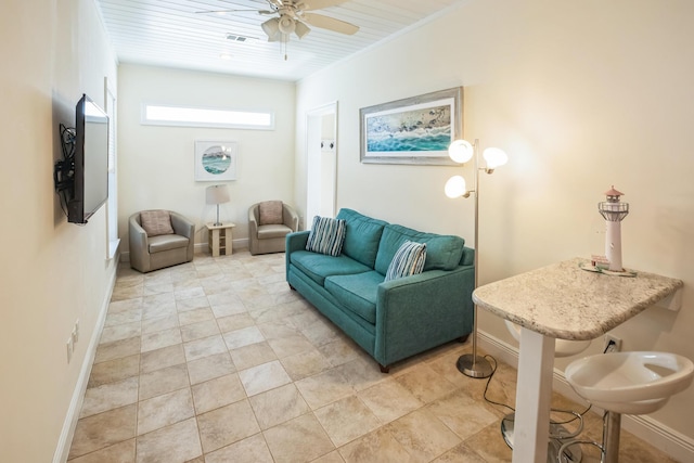 living room with visible vents, ceiling fan, and baseboards