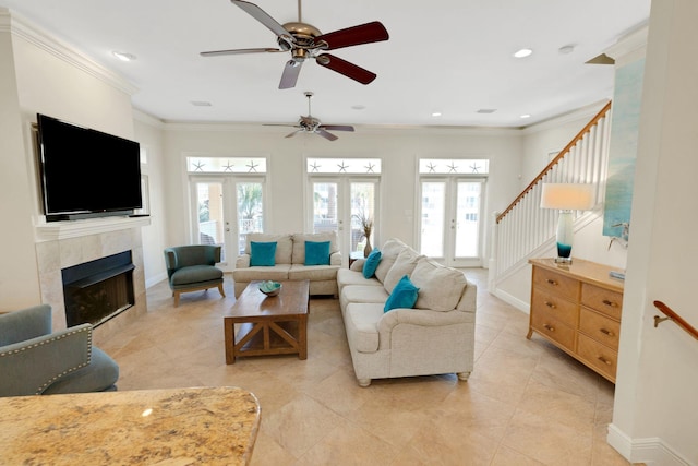 living room with french doors, a healthy amount of sunlight, and crown molding