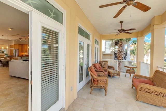 sunroom / solarium with ceiling fan