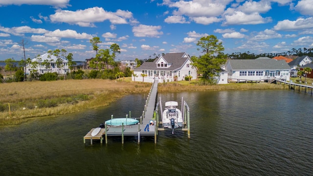 dock area with a water view and boat lift