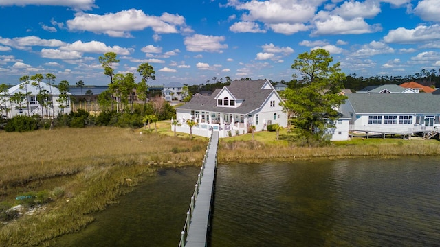 exterior space featuring a water view and a residential view