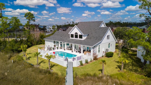 back of house with a lawn, a patio area, and a fenced backyard