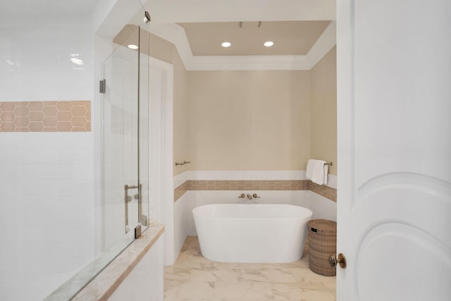 bathroom with a soaking tub, a stall shower, marble finish floor, and ornamental molding