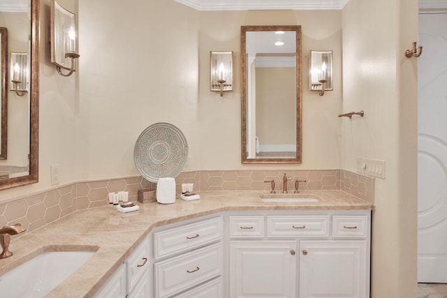 bathroom with double vanity, backsplash, crown molding, and a sink