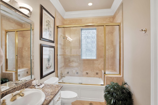 full bath featuring vanity, crown molding, toilet, and combined bath / shower with glass door