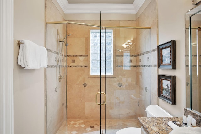 bathroom featuring vanity, toilet, a shower stall, and crown molding