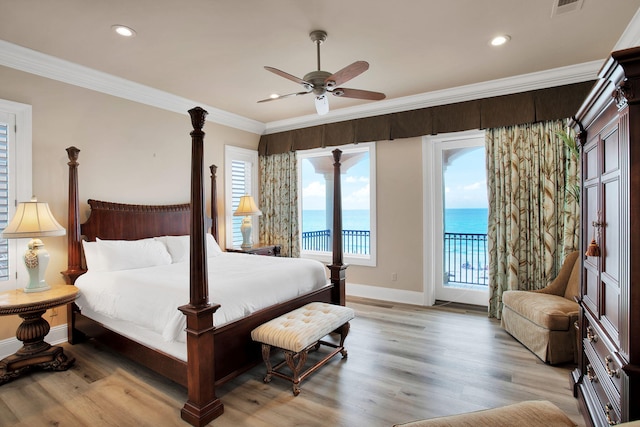 bedroom featuring access to exterior, light wood-style floors, and ornamental molding