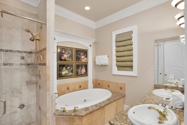 full bath featuring a stall shower, a jetted tub, crown molding, and a sink