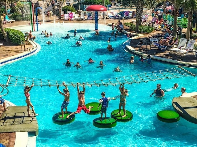 community pool with a water play area