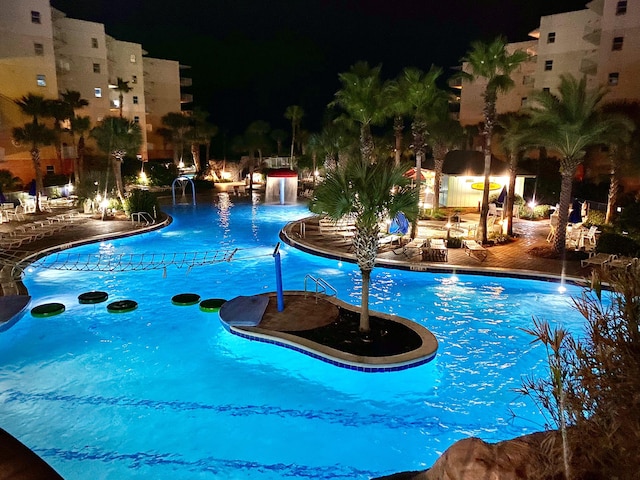 pool at night with a community pool