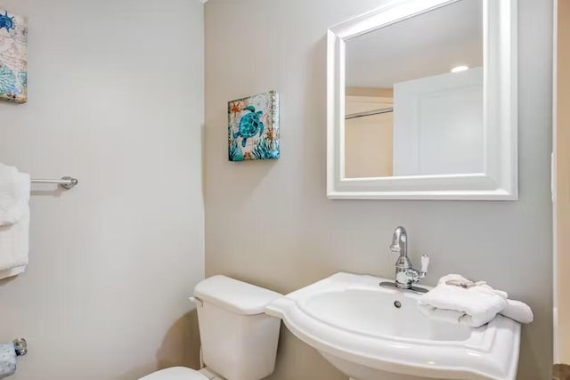 bathroom featuring a sink and toilet