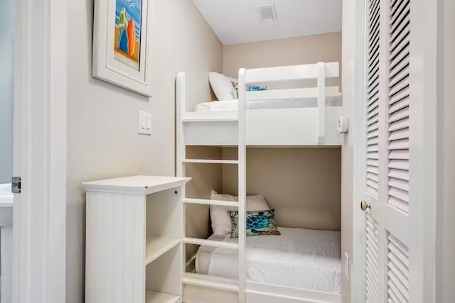 unfurnished bedroom with visible vents