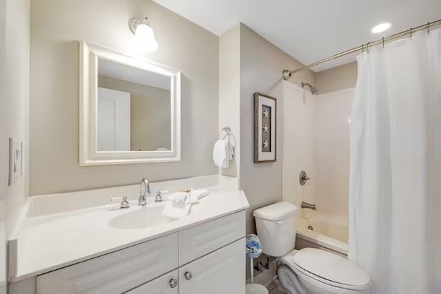 bathroom featuring shower / tub combo with curtain, vanity, and toilet