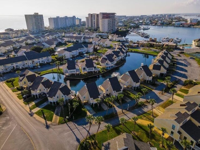 drone / aerial view featuring a water view and a city view