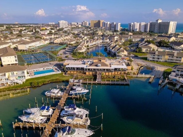 birds eye view of property with a view of city and a water view