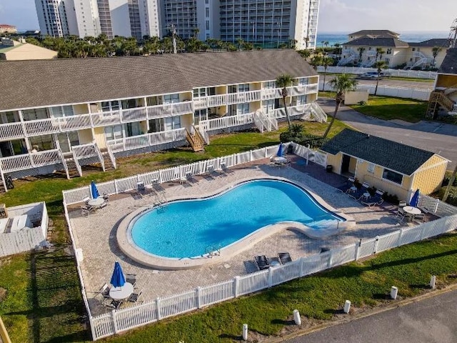 pool featuring a patio area and fence