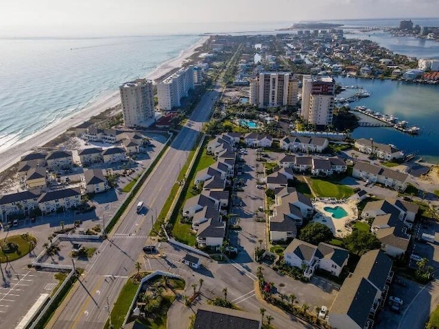 birds eye view of property featuring a water view, a city view, and a view of the beach