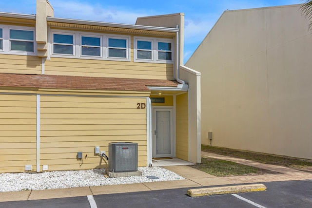 property entrance with uncovered parking