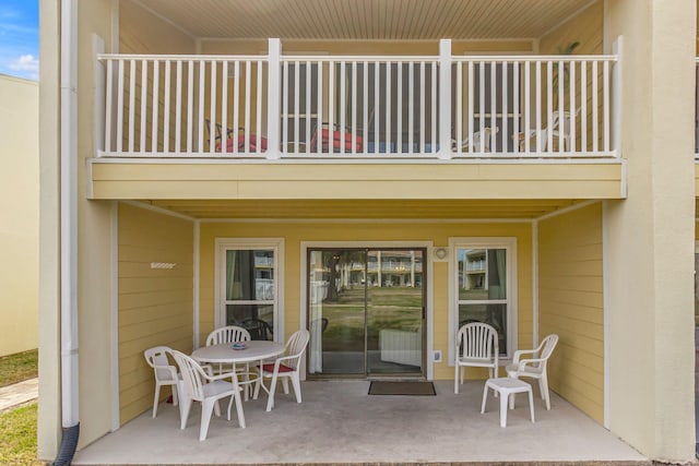 doorway to property featuring a balcony and a patio area