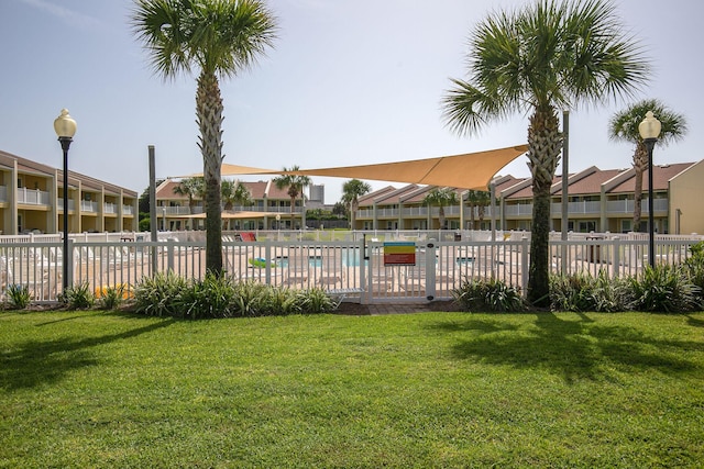 view of yard featuring a residential view and fence