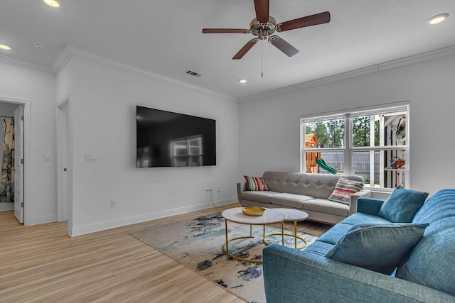 living area featuring recessed lighting, visible vents, light wood-style floors, ornamental molding, and baseboards