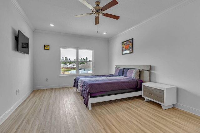 bedroom with baseboards, light wood-type flooring, and crown molding