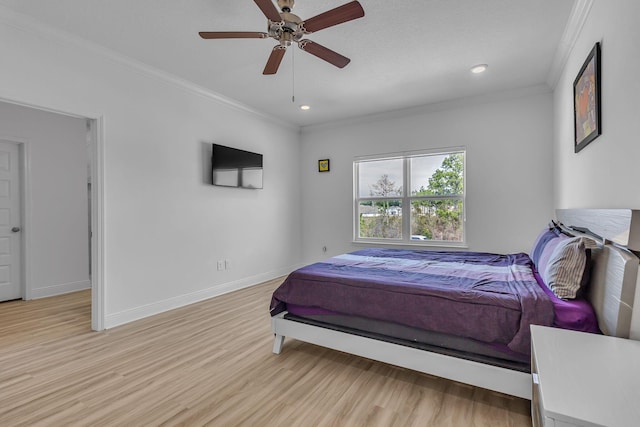 bedroom with recessed lighting, a ceiling fan, baseboards, ornamental molding, and light wood-type flooring