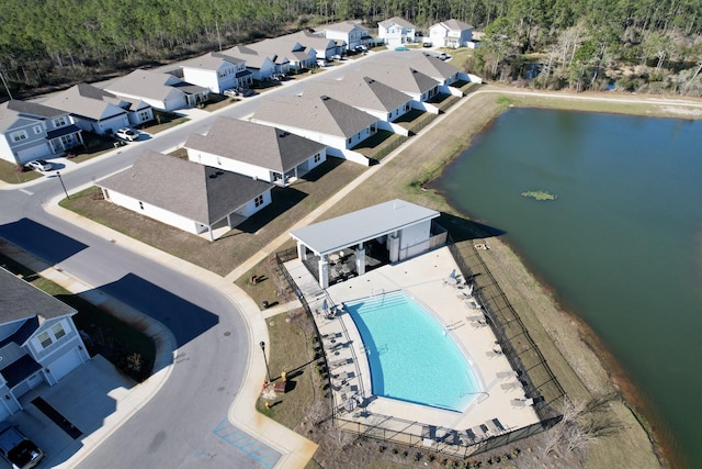 aerial view with a water view and a residential view