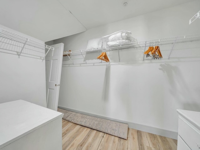 spacious closet with wood finished floors