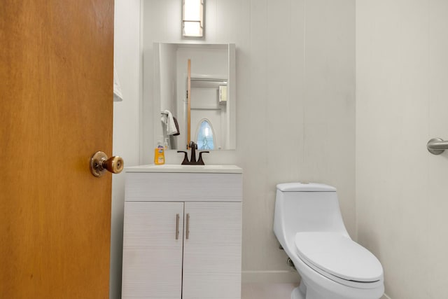 half bath with vanity and toilet