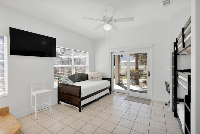 interior space featuring visible vents, ceiling fan, baseboards, and light tile patterned floors